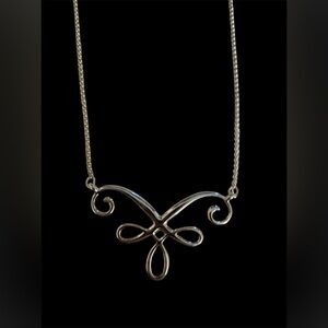 Silver colored Magnabilities necklace. Very shiny. Scroll design. NWOT